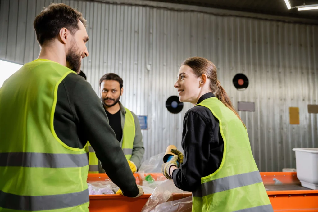 Team discussing recycling at a waste management facility