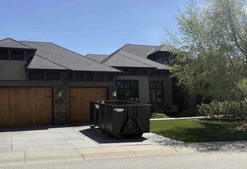 Cal-Waste bin in front of a Calgary home during a clean-out